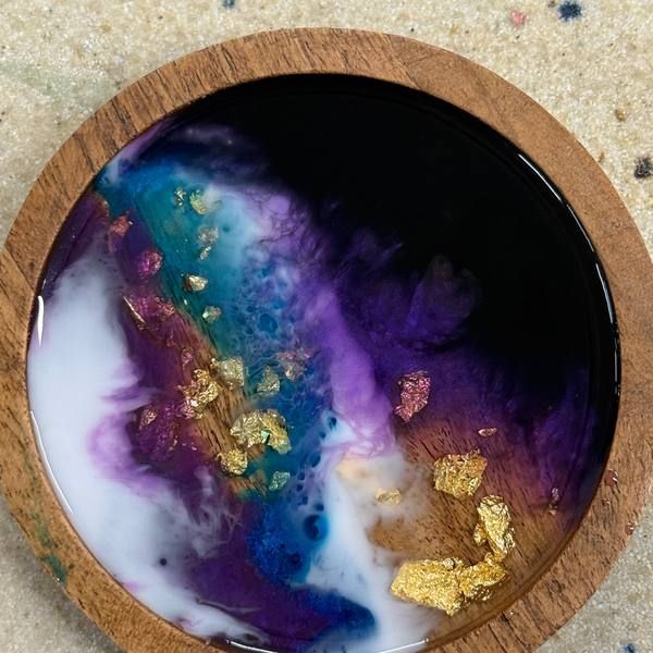 Round resin board with purple galaxy swirls and gold leaf