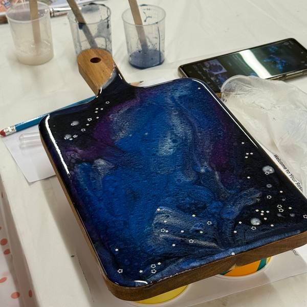 A blue resin board in progress