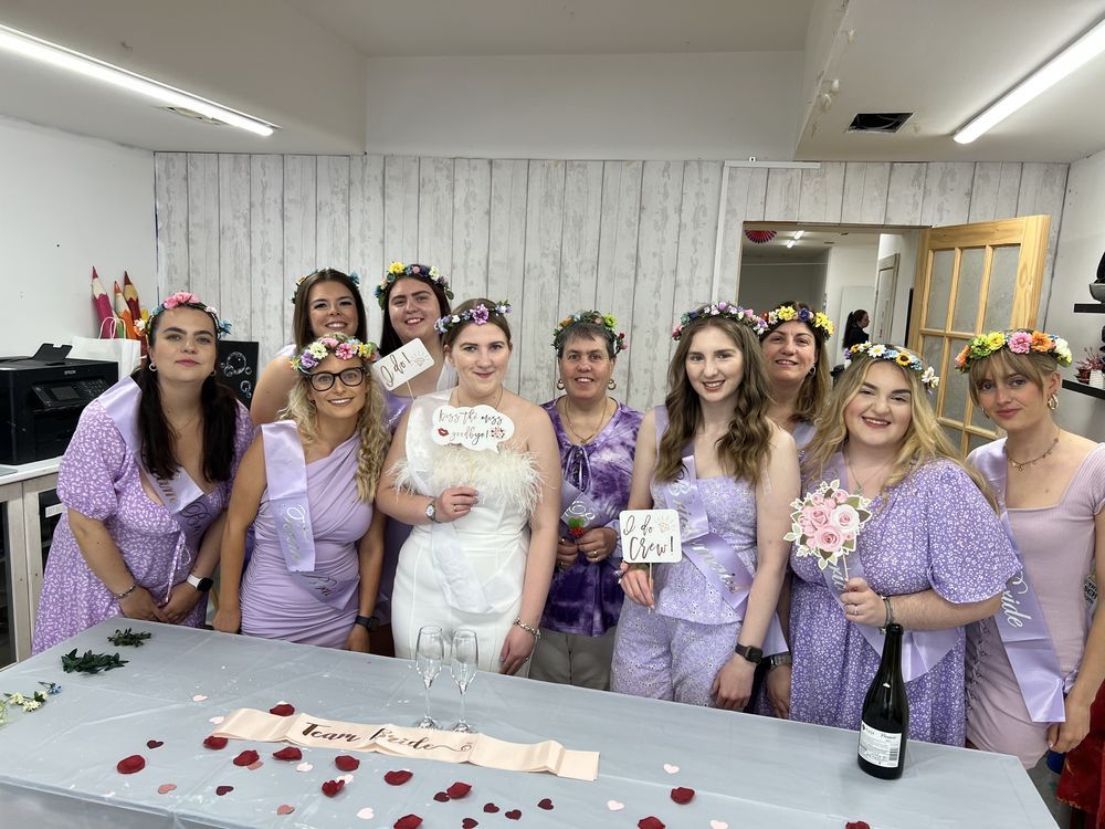 A hen party group with their finished paintings