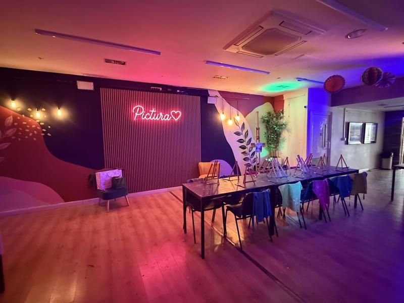 The party room set up with easels and canvases for a children's birthday painting party